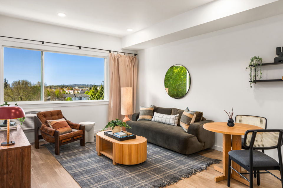 Modern living room with stylish decor and ample seating in Prose Kent Station Apartments luxury community