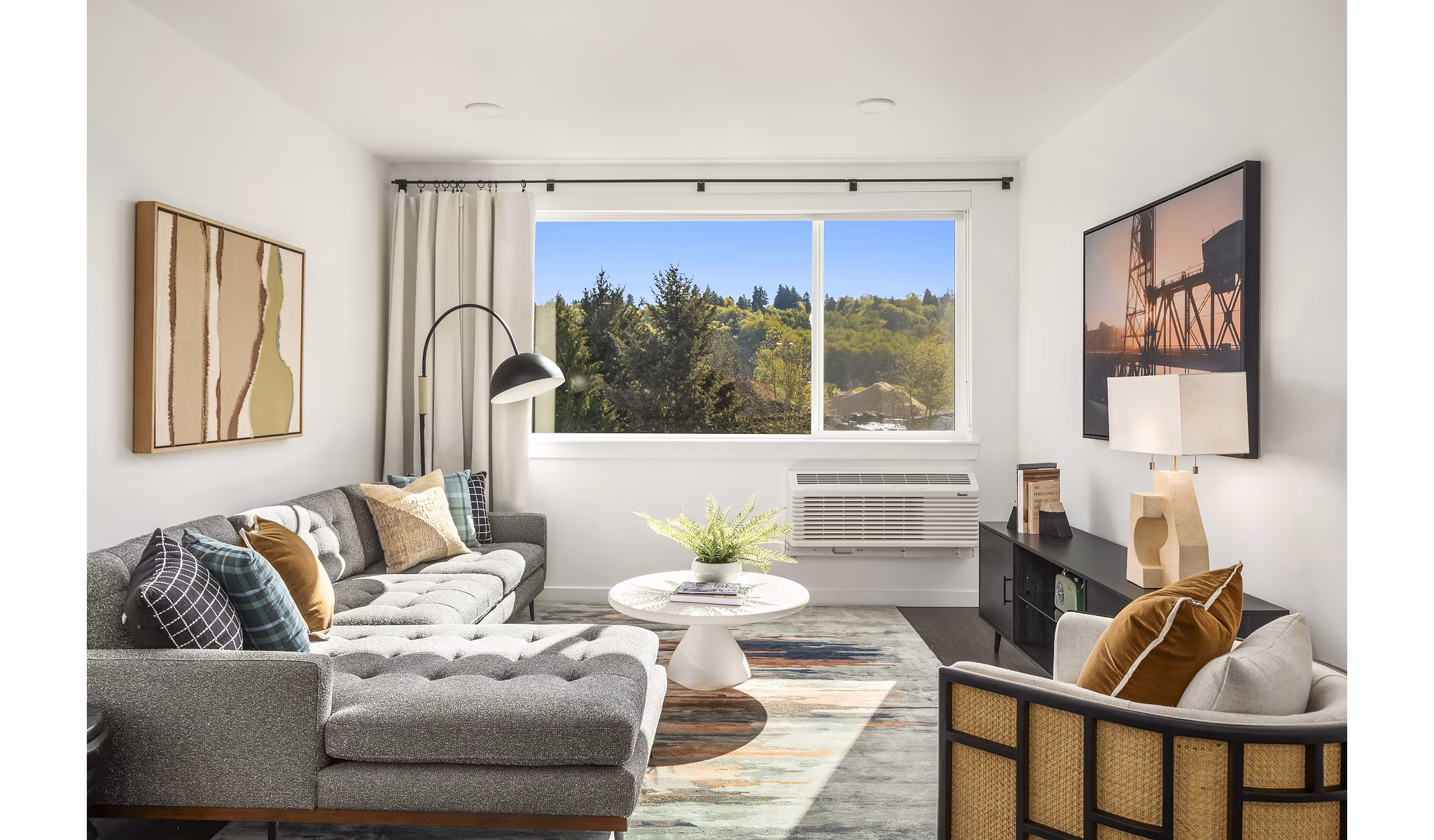 Cozy living room with plush furniture and natural light at Prose Kent Station Apartments, ideal for relaxation and comfort