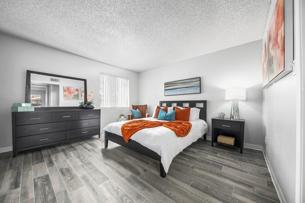 Bedroom with elegant decor and large windows at Sierra Pines Apartments, luxury living by Greystar