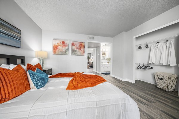 Bedroom featuring contemporary design and plush bedding at Sierra Pines Apartments, luxury living by Greystar