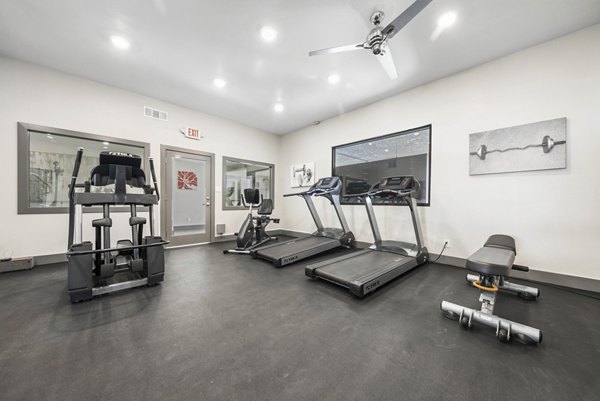 Modern fitness center with state-of-the-art equipment at Sierra Pines Apartments