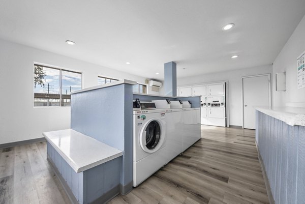 Modern laundry facility with efficient machines at Sierra Pines Apartments