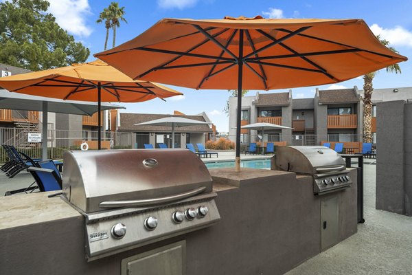 Grill area with cozy seating at Sierra Pines Apartments Perfect for outdoor gatherings and barbecues