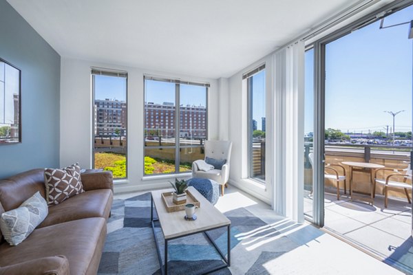 Spacious living room with contemporary decor at Flats on D Apartments