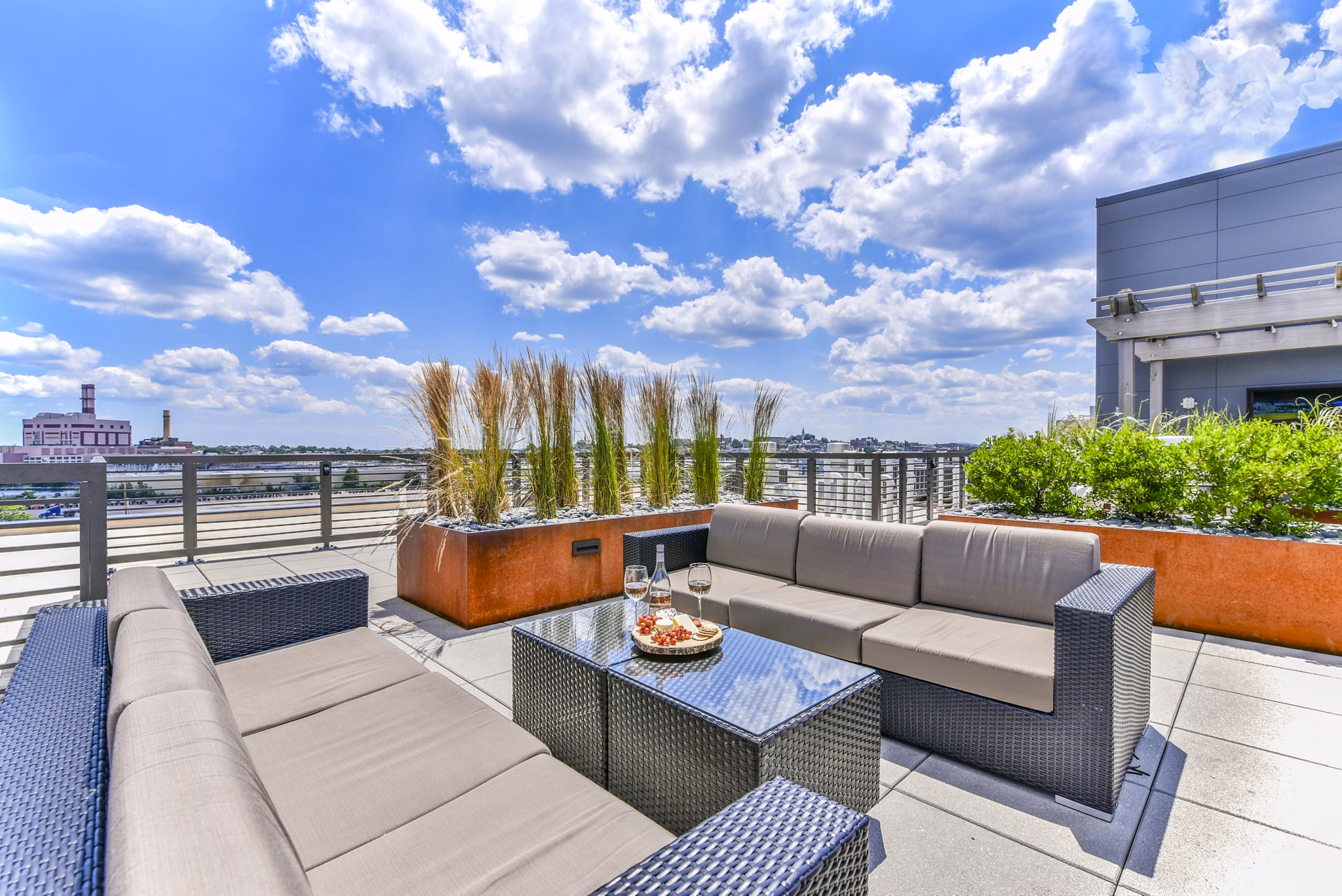 Cozy patio area with modern seating at Flats on D Apartments, perfect for relaxing outdoors