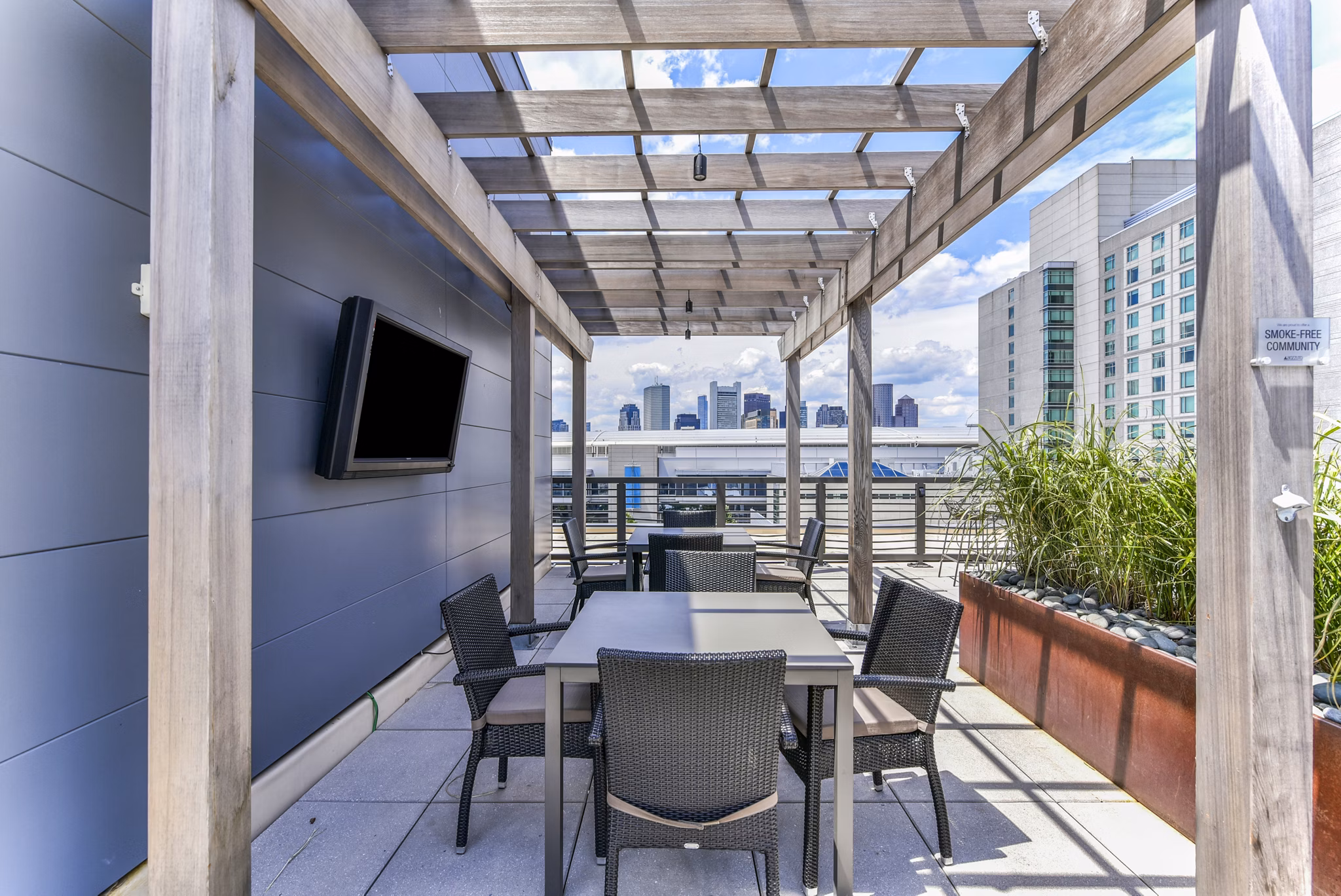 Chic patio with comfortable seating at Flats on D Apartments