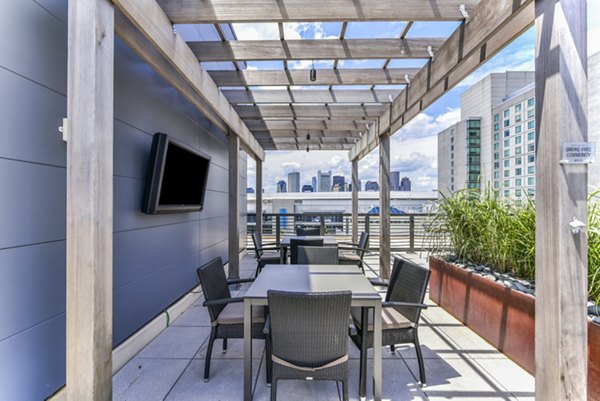 Chic patio with comfortable seating at Flats on D Apartments