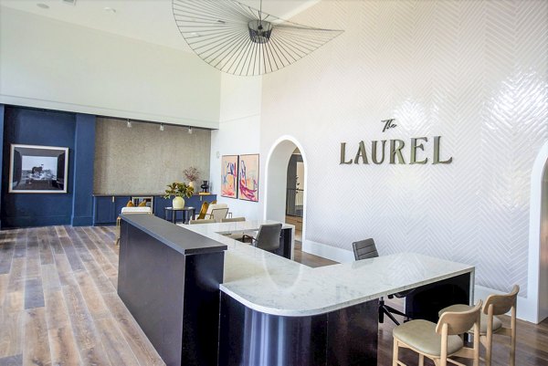 Clubhouse featuring modern design and cozy seating at The Laurel Apartments