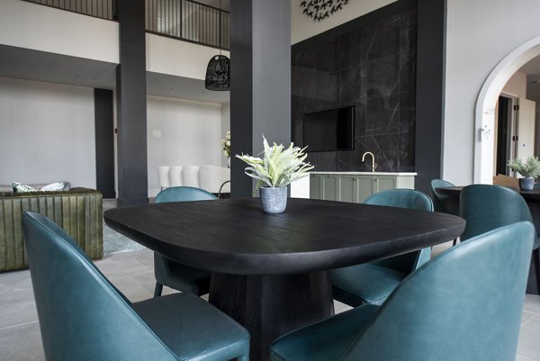 Elegant clubhouse with modern furnishings at The Laurel Apartments, offering luxury living spaces for residents to relax and socialize