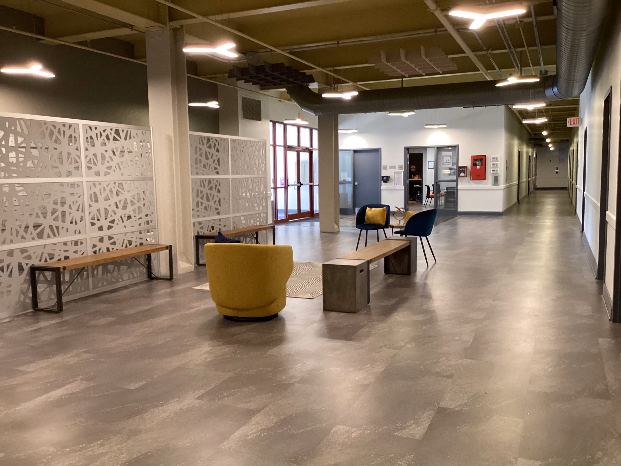 Clubhouse with modern lounge seating and entertainment area at Heinz Lofts Apartments in Pittsburgh