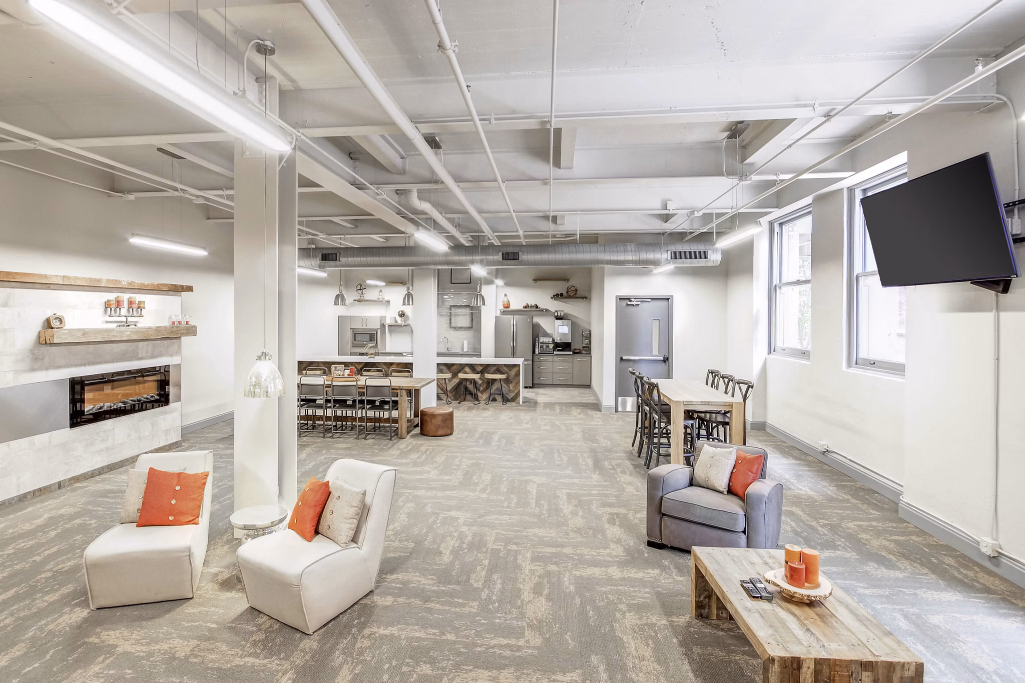 Elegant clubhouse featuring modern decor and seating at Heinz Lofts Apartments