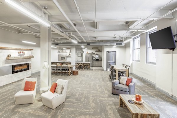 Elegant clubhouse featuring modern decor and seating at Heinz Lofts Apartments