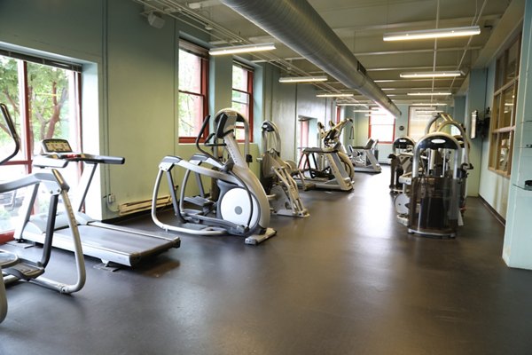 Modern fitness center with state-of-the-art equipment at Heinz Lofts Apartments