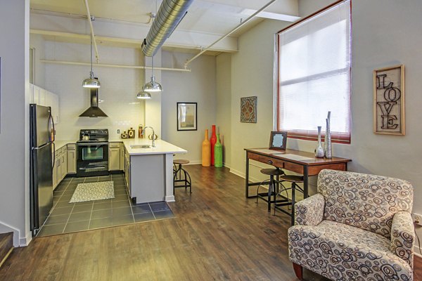 Modern kitchen with stainless steel appliances in Heinz Lofts Apartments