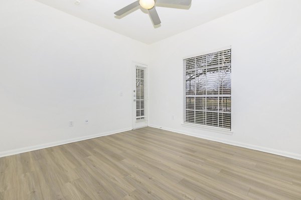 Cozy bedroom with modern decor in City Park at The Heights Apartments