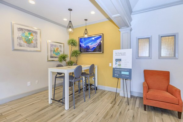 Clubhouse featuring modern decor and spacious seating at City Park in The Heights Apartments
