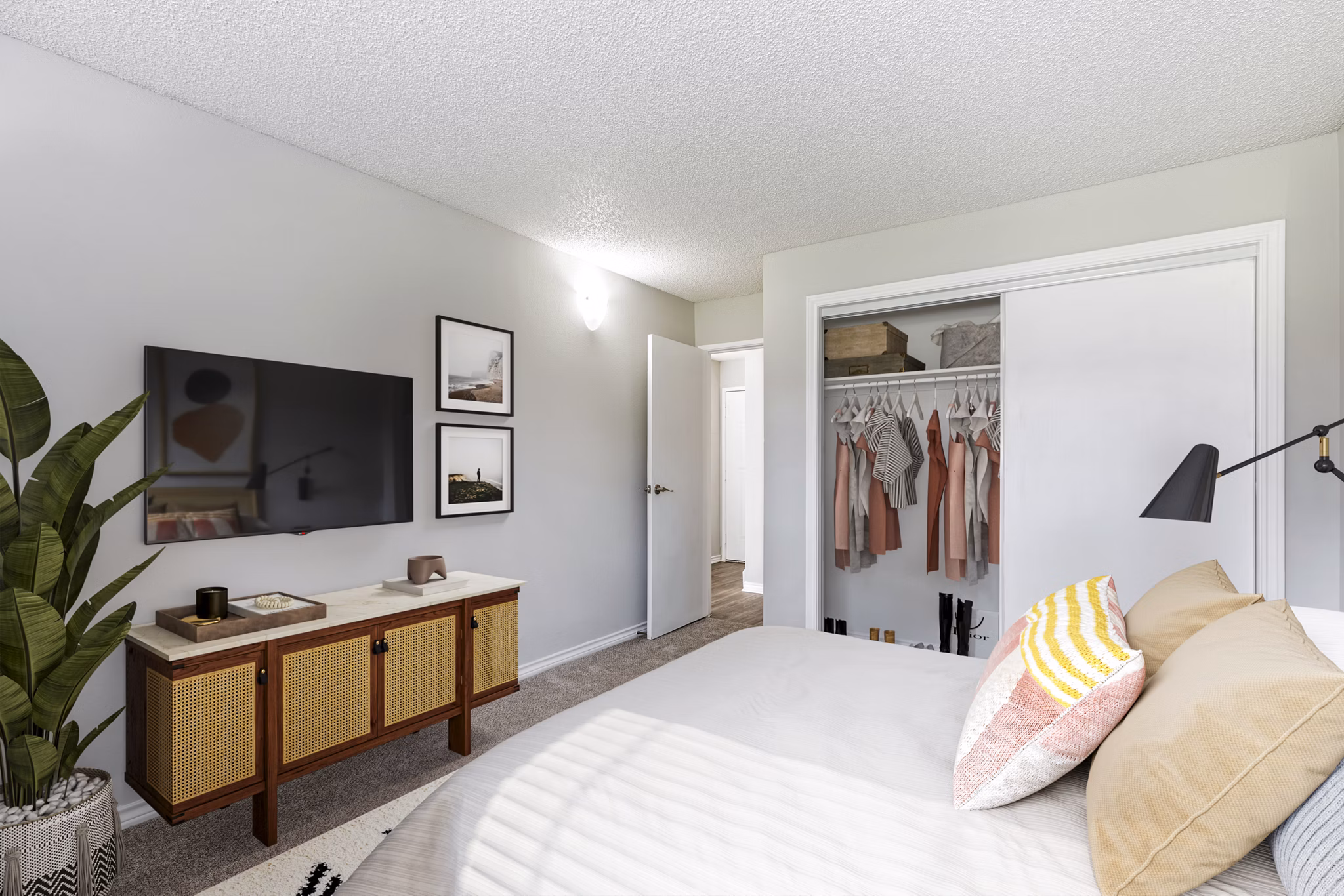 Cozy bedroom with modern finishes at Belmar Villas Apartments, featuring luxury ambience and comfort in a prime location