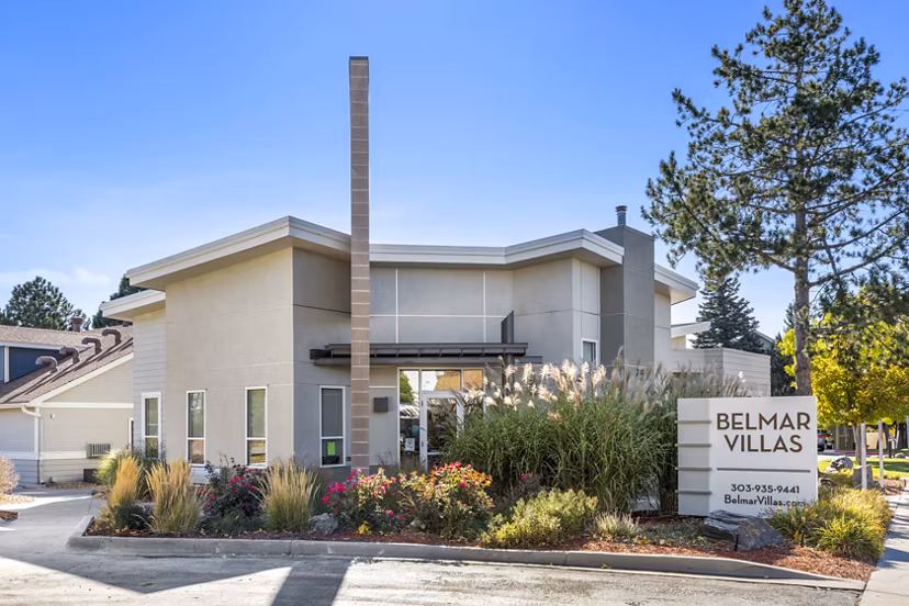 Elegant clubhouse with modern furnishings at Belmar Villas Apartments, fostering a community atmosphere in a luxury setting