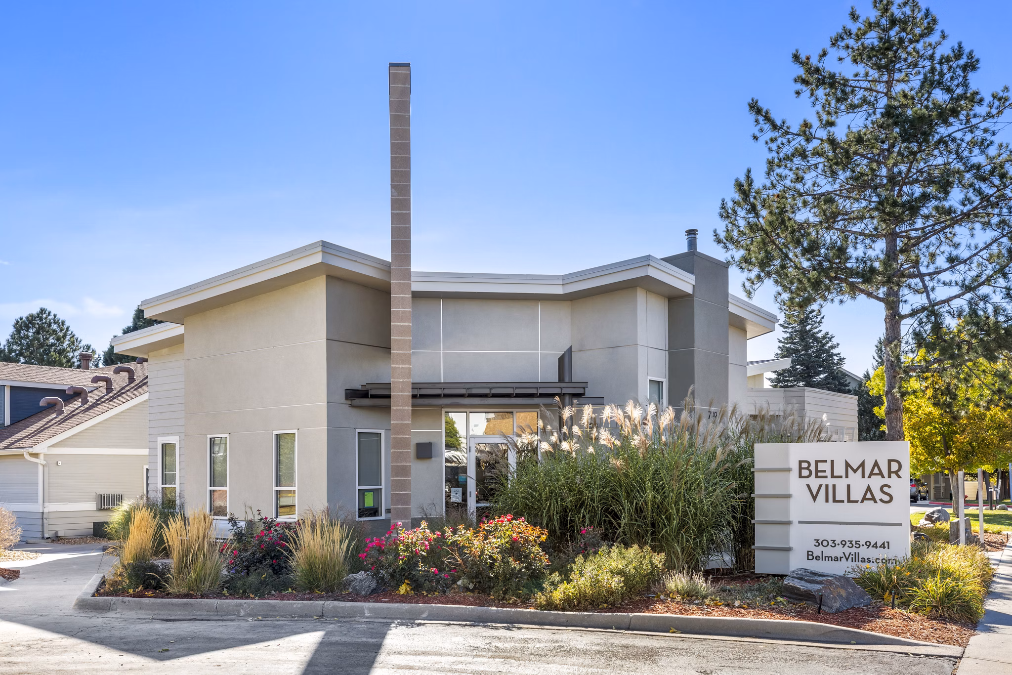 Elegant clubhouse with modern furnishings at Belmar Villas Apartments, fostering a community atmosphere in a luxury setting