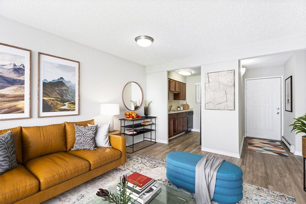 Spacious modern living room with stylish furnishings at Belmar Villas Apartments, offering luxury living