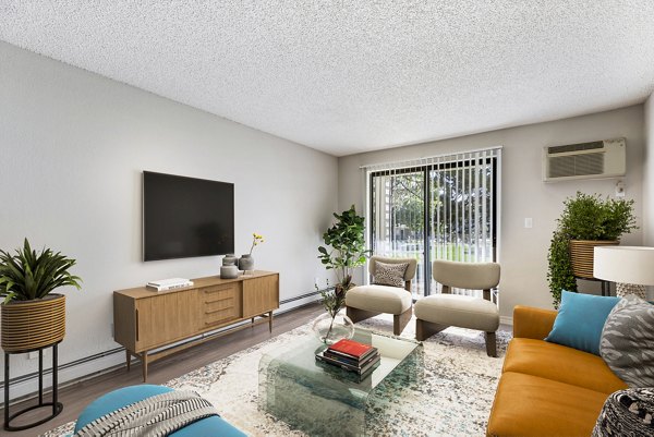 Comfortable living room with stylish decor at Belmar Villas Apartments