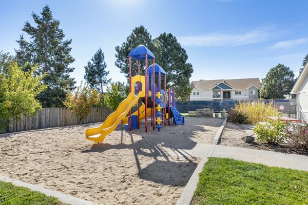 Colorful playground area at Belmar Villas Apartments offering family-friendly amenities for luxurious living
