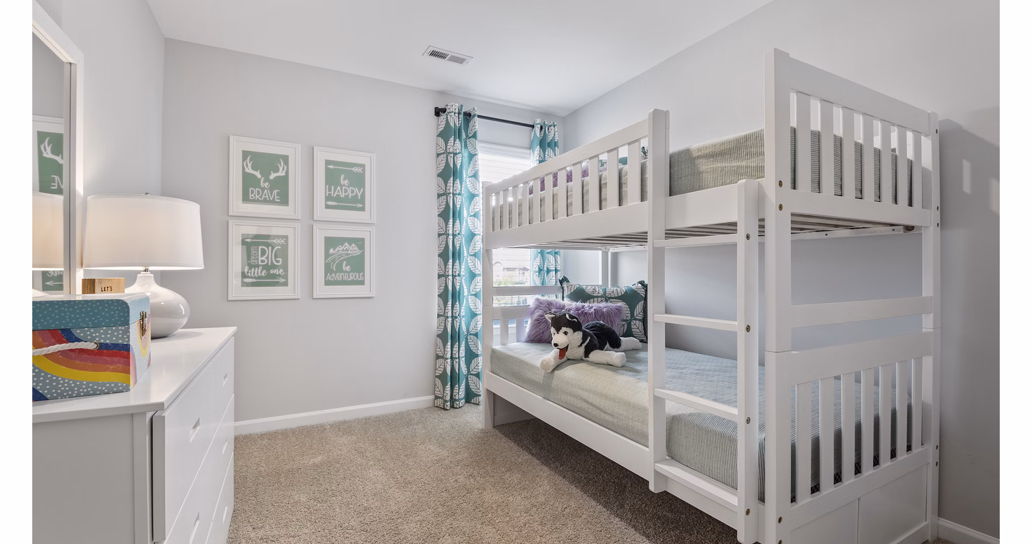 Bedroom featuring elegant decor and plush bedding in Rosemary Glen Apartments