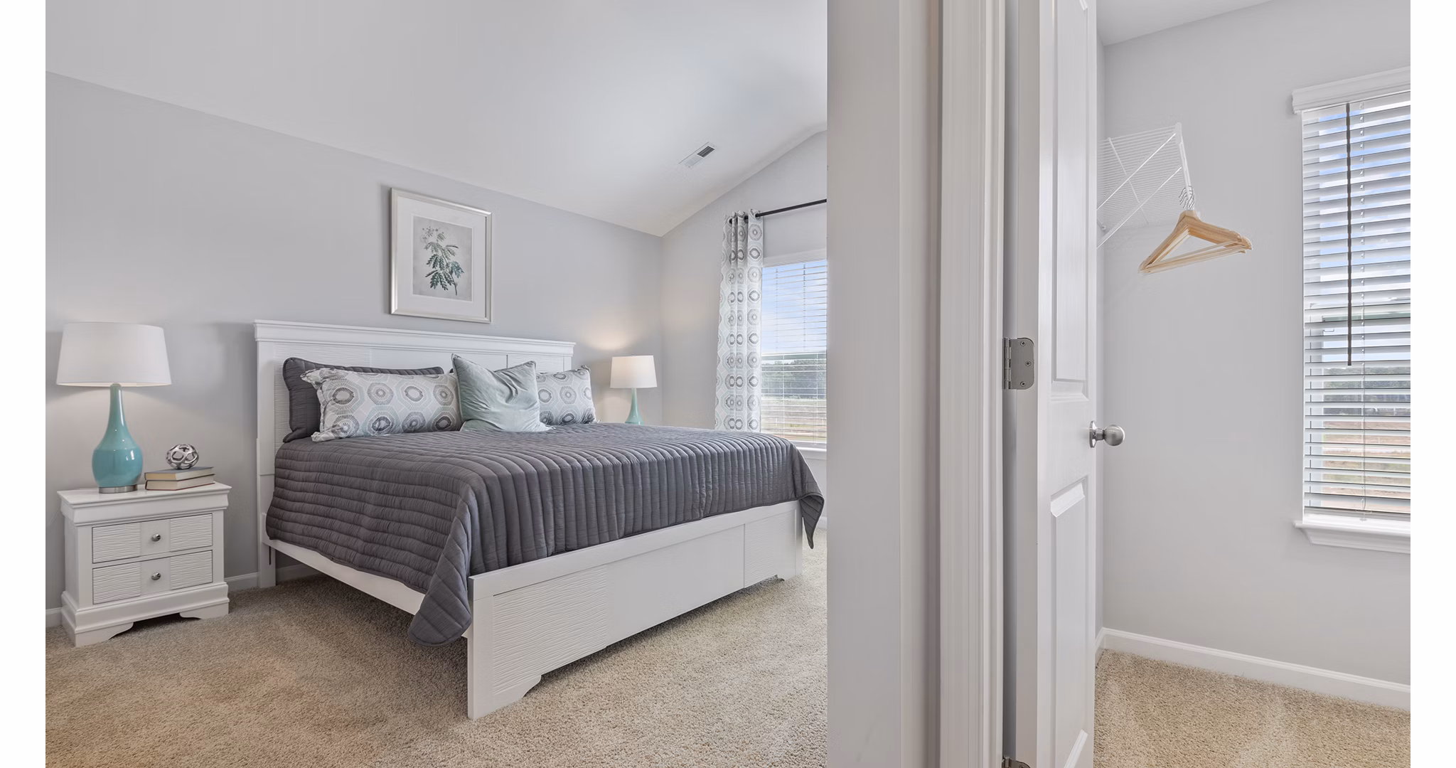 Spacious bedroom with modern decor in Rosemary Glen Apartments