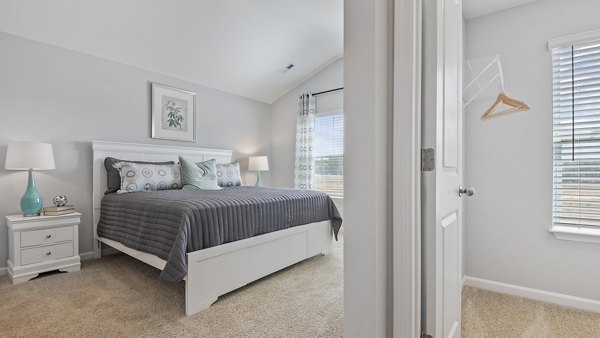 Spacious bedroom with modern decor in Rosemary Glen Apartments