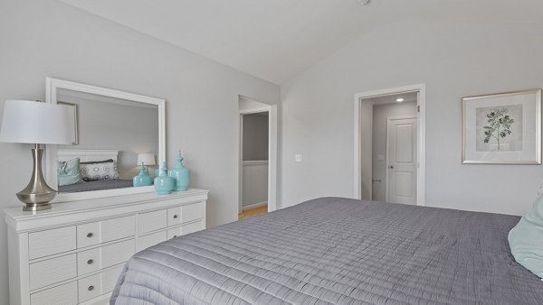Cozy bedroom with modern design at Rosemary Glen Apartments