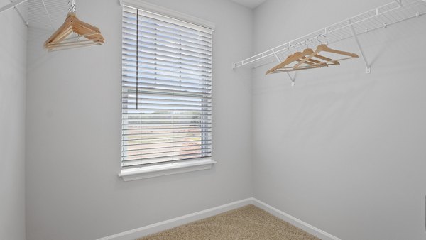 Walk-in closet with ample storage at Rosemary Glen Apartments