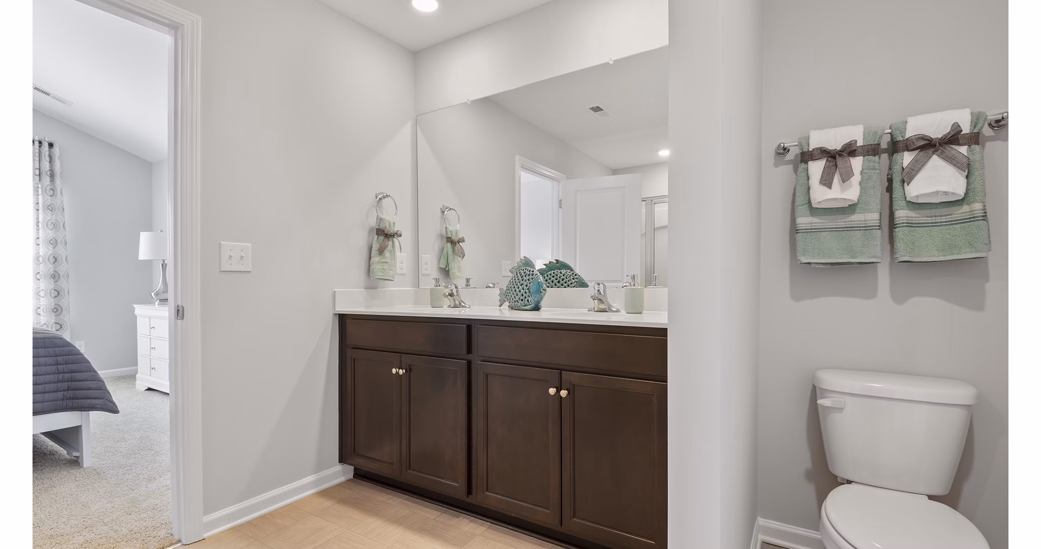 Luxurious bathroom with sleek finishes and modern fixtures at Rosemary Glen Apartments