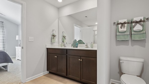 Luxurious bathroom with sleek finishes and modern fixtures at Rosemary Glen Apartments