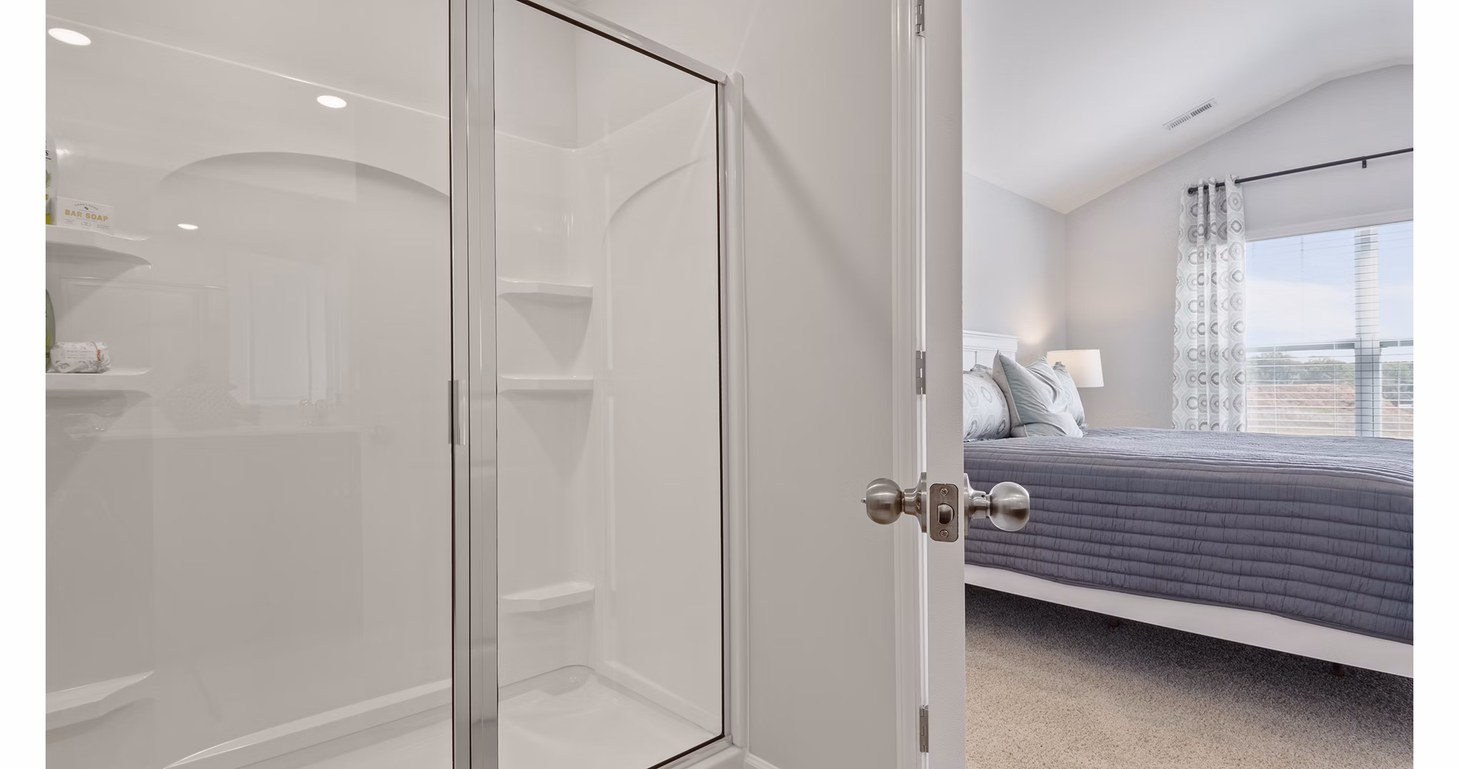 Bathroom featuring sleek fixtures and neutral tones at Rosemary Glen Apartments