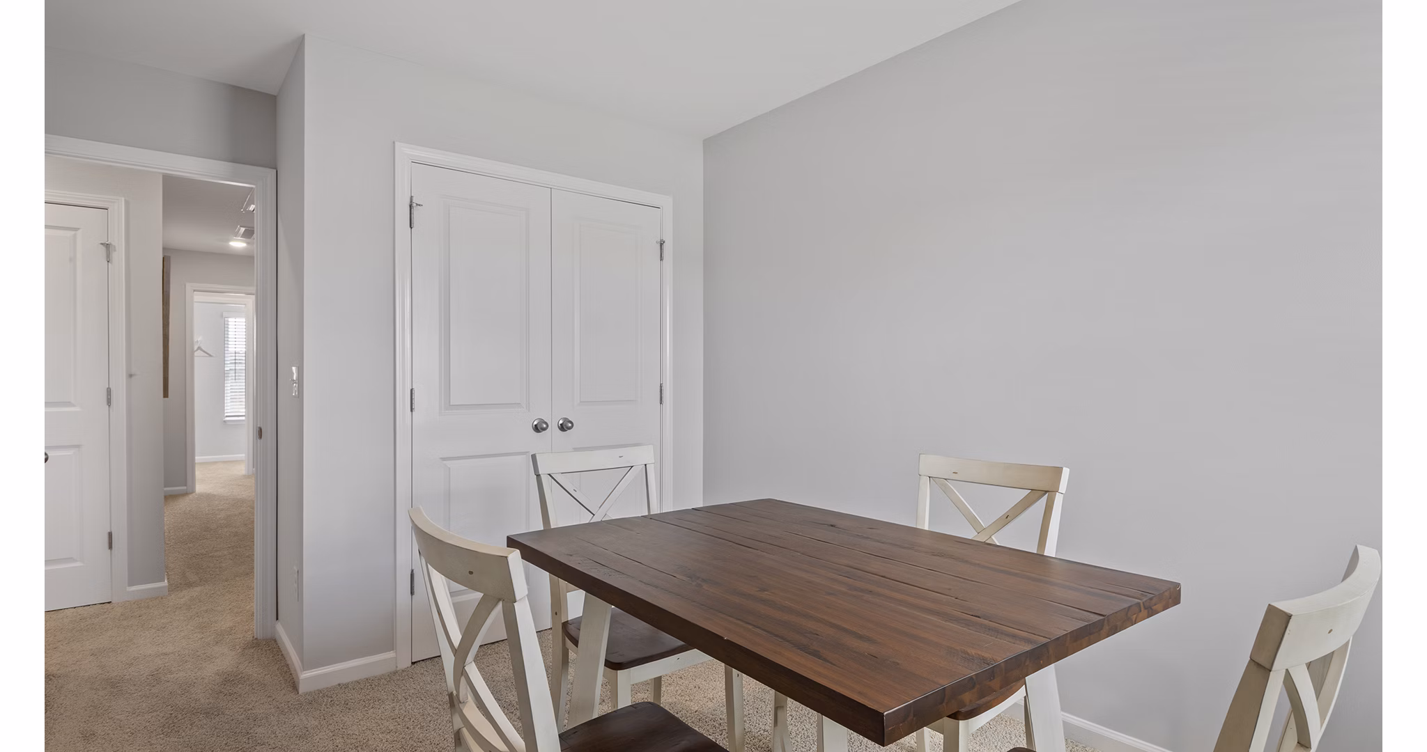 Chic dining area with modern furnishings at Rosemary Glen Apartments, ideal for luxury living