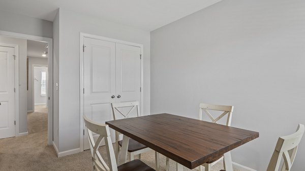 Chic dining area with modern furnishings at Rosemary Glen Apartments, ideal for luxury living