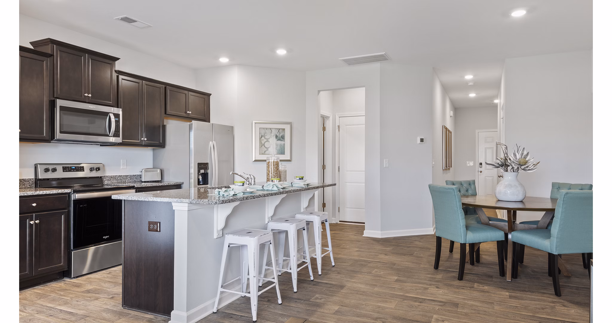 Rosemary Glen Apartments: Modern kitchen with stainless steel appliances and granite countertops