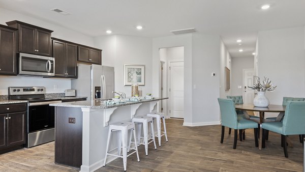 Rosemary Glen Apartments: Modern kitchen with stainless steel appliances and granite countertops