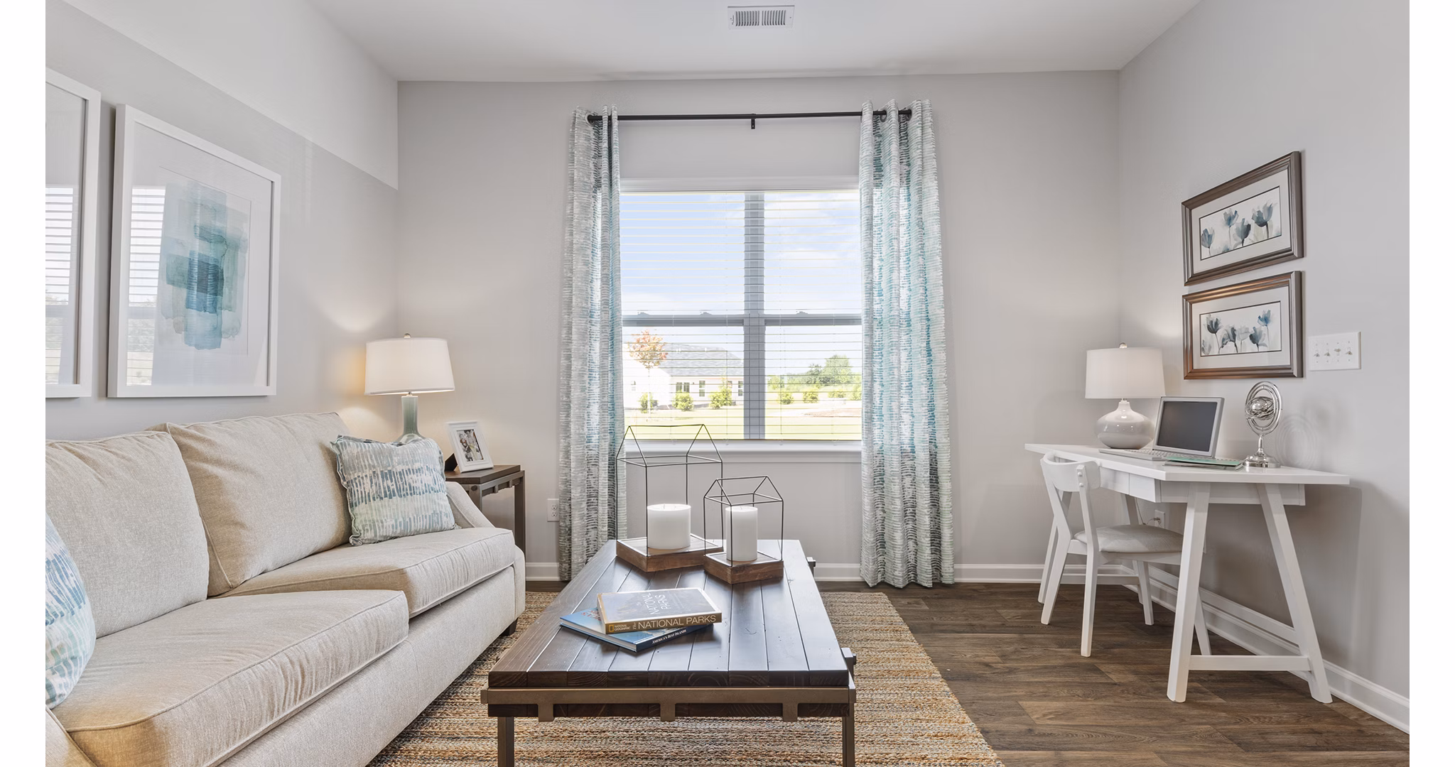 Modern living room with stylish furniture and natural light at Rosemary Glen Apartments
