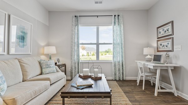 Modern living room with stylish furniture and natural light at Rosemary Glen Apartments