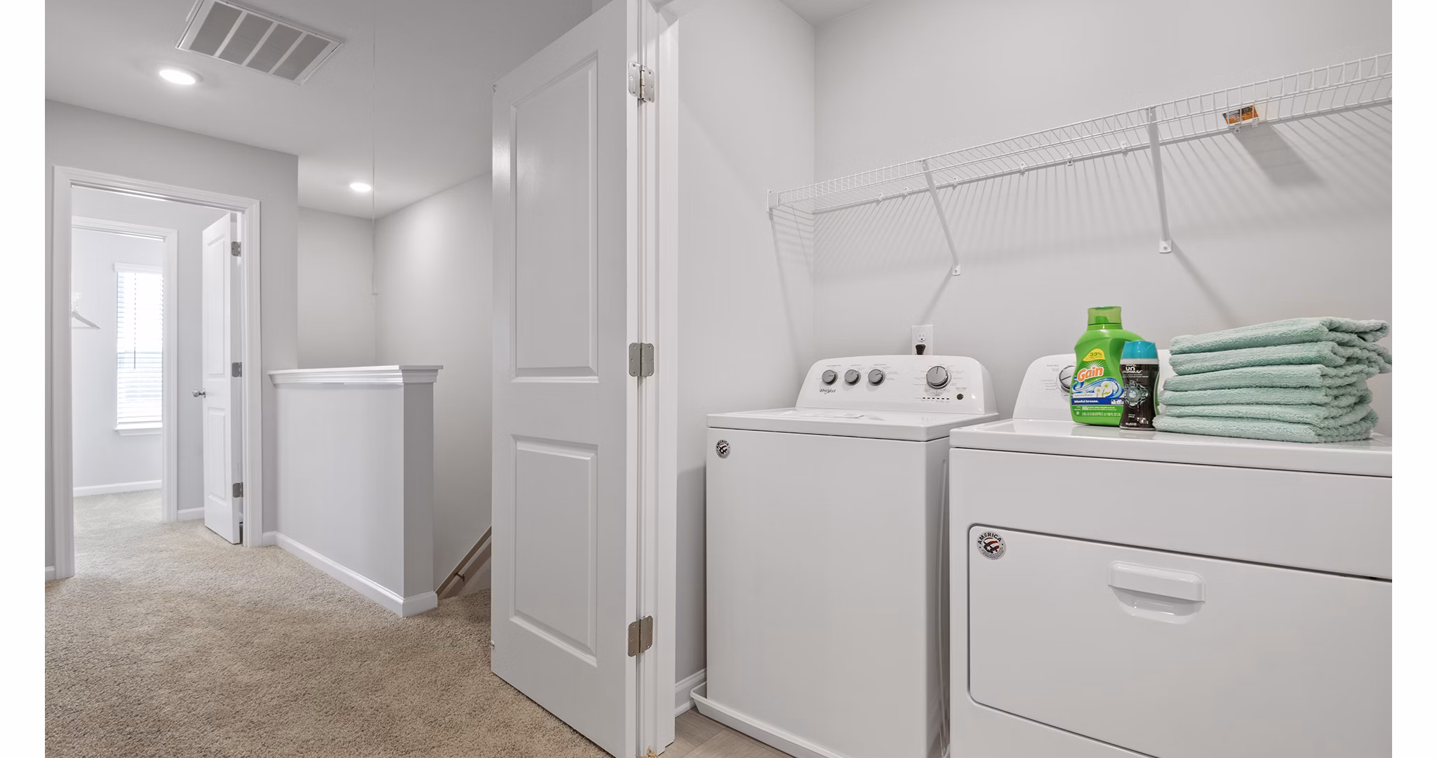 Laundry room equipped with modern washers and dryers in Rosemary Glen Apartments