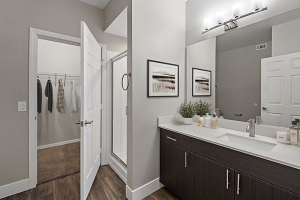 Bathroom at Cyan at Green Valley Apartments featuring modern fixtures and sleek design