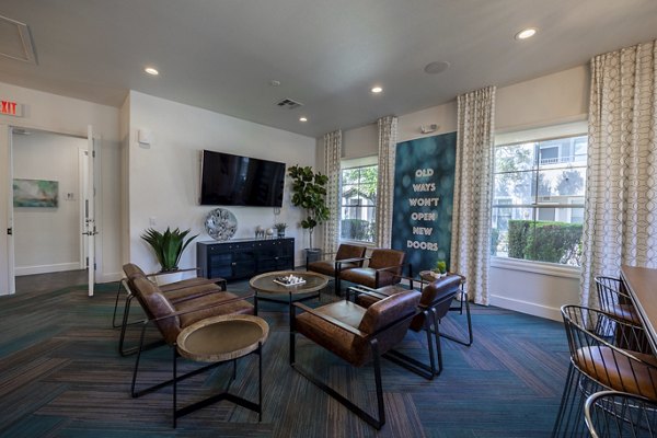 Cyan at Green Valley Apartments: Modern clubhouse featuring elegant seating and entertainment spaces