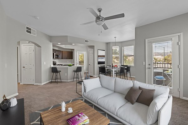 Bright living room with modern furnishings at Cyan at Green Valley Apartments, luxury living in scenic surroundings