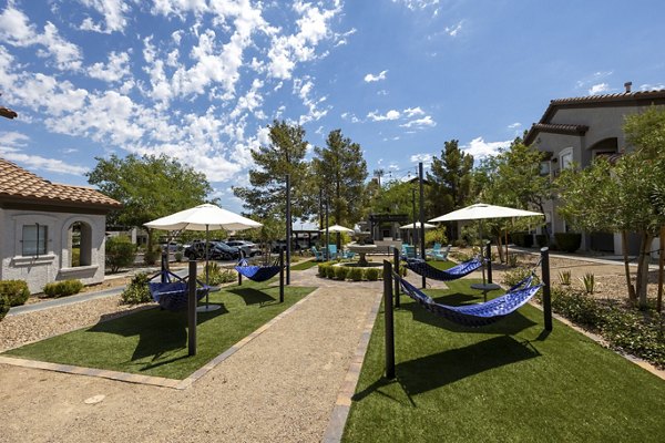 Courtyard with lush landscaping and seating areas at Milano Apartments