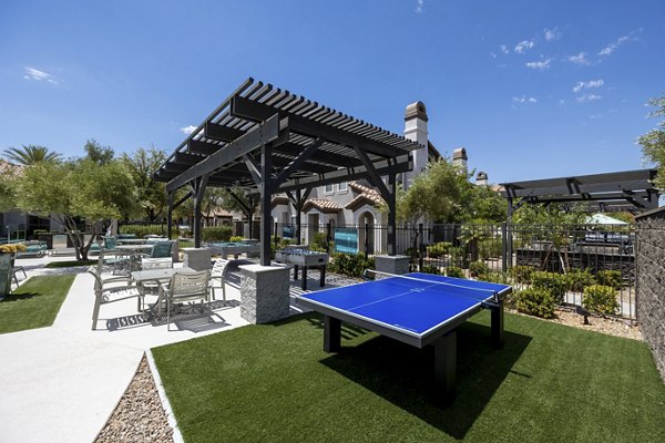 Courtyard with lush landscaping and modern seating at Milano Apartments, a luxury property in the heart of the city