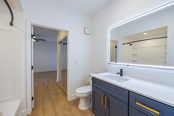 Elegant bathroom with modern fixtures at The Presley at Whitney Ranch Apartments, a luxurious community by Greystar