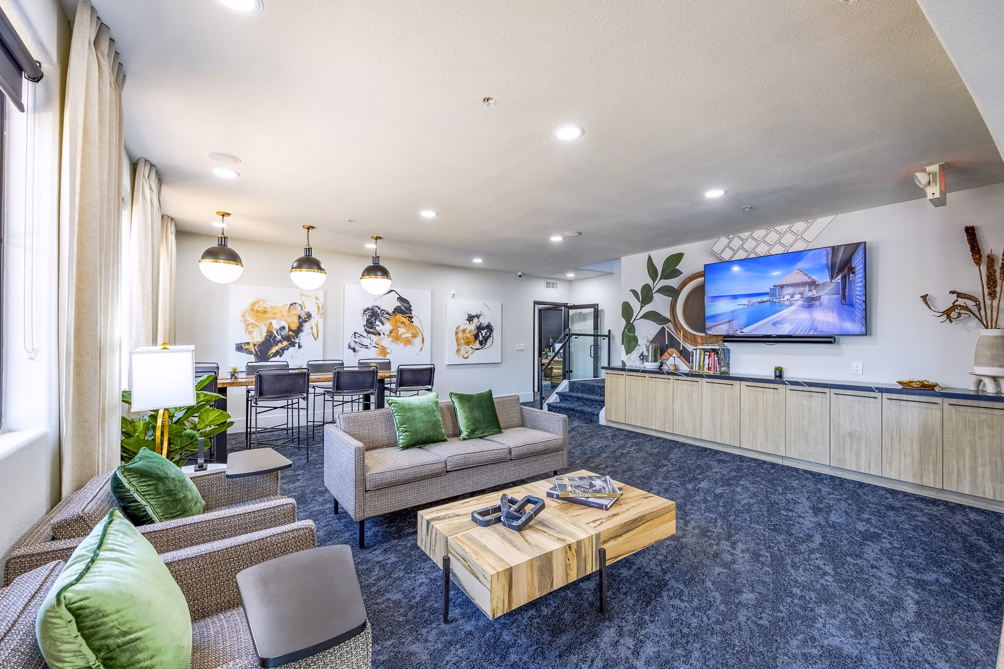 Clubhouse featuring modern decor and seating at The Presley at Whitney Ranch Apartments
