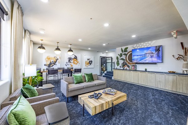 Clubhouse featuring modern decor and seating at The Presley at Whitney Ranch Apartments