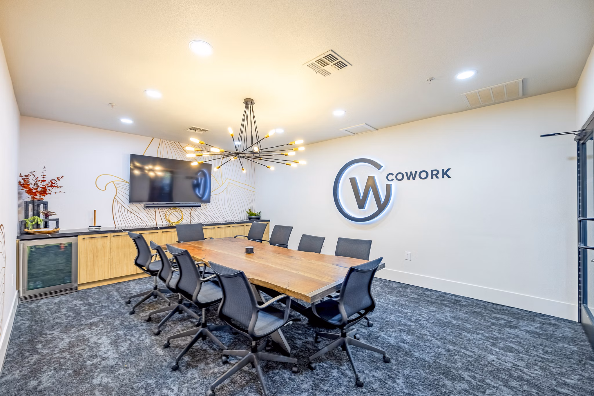 Clubhouse meeting facility with modern seating and tech amenities at The Presley at Whitney Ranch Apartments